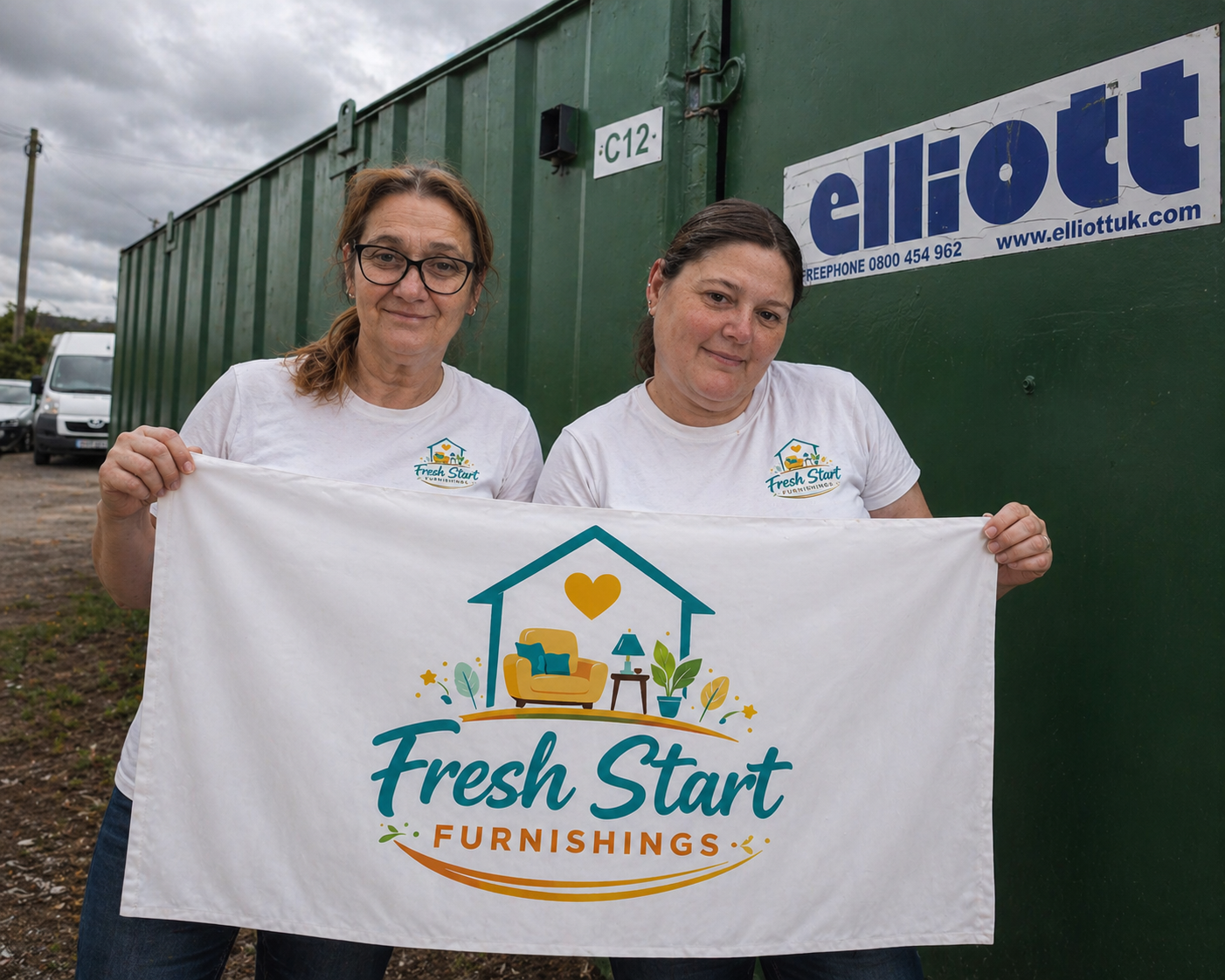 Carrie and Mel, founders of Fresh Start Furnishings, holding a banner outside their Shrewsbury container shop